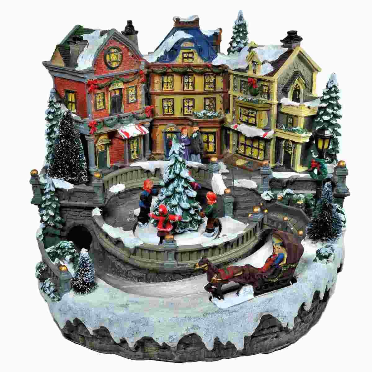 Giostra Natale Villaggio Luci Mov. Suoni a Batterie cm.28xh24 |Vacchetti