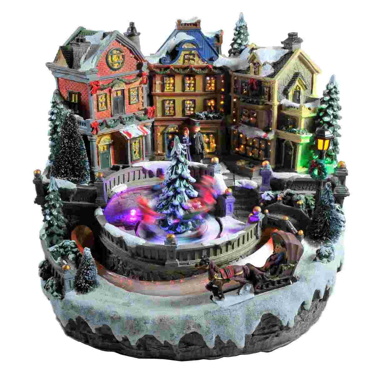 Giostra Natale Villaggio Luci Mov. Suoni a Batterie cm.28xh24 |Vacchetti