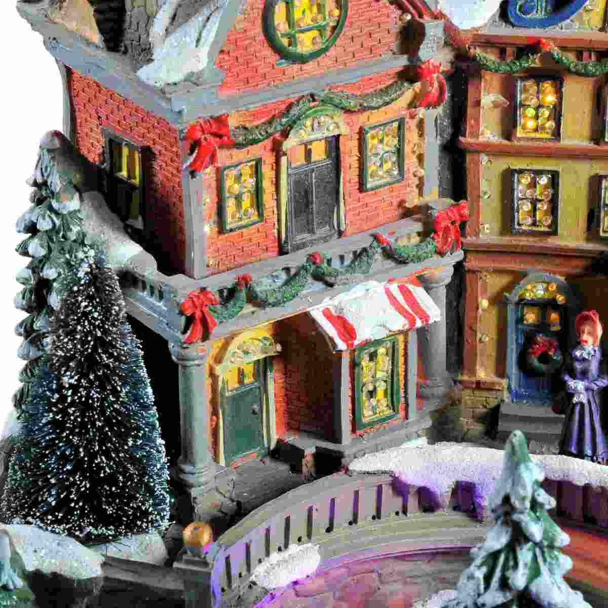 Giostra Natale Villaggio Luci Mov. Suoni a Batterie cm.28xh24 |Vacchetti