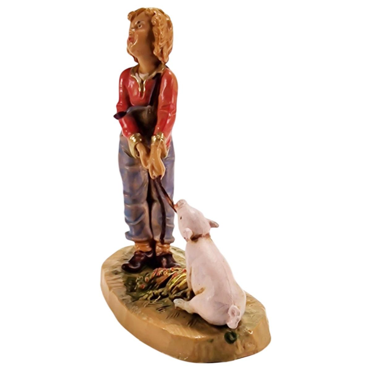 Statua presepe 12 cm bambino che tira il maiale
